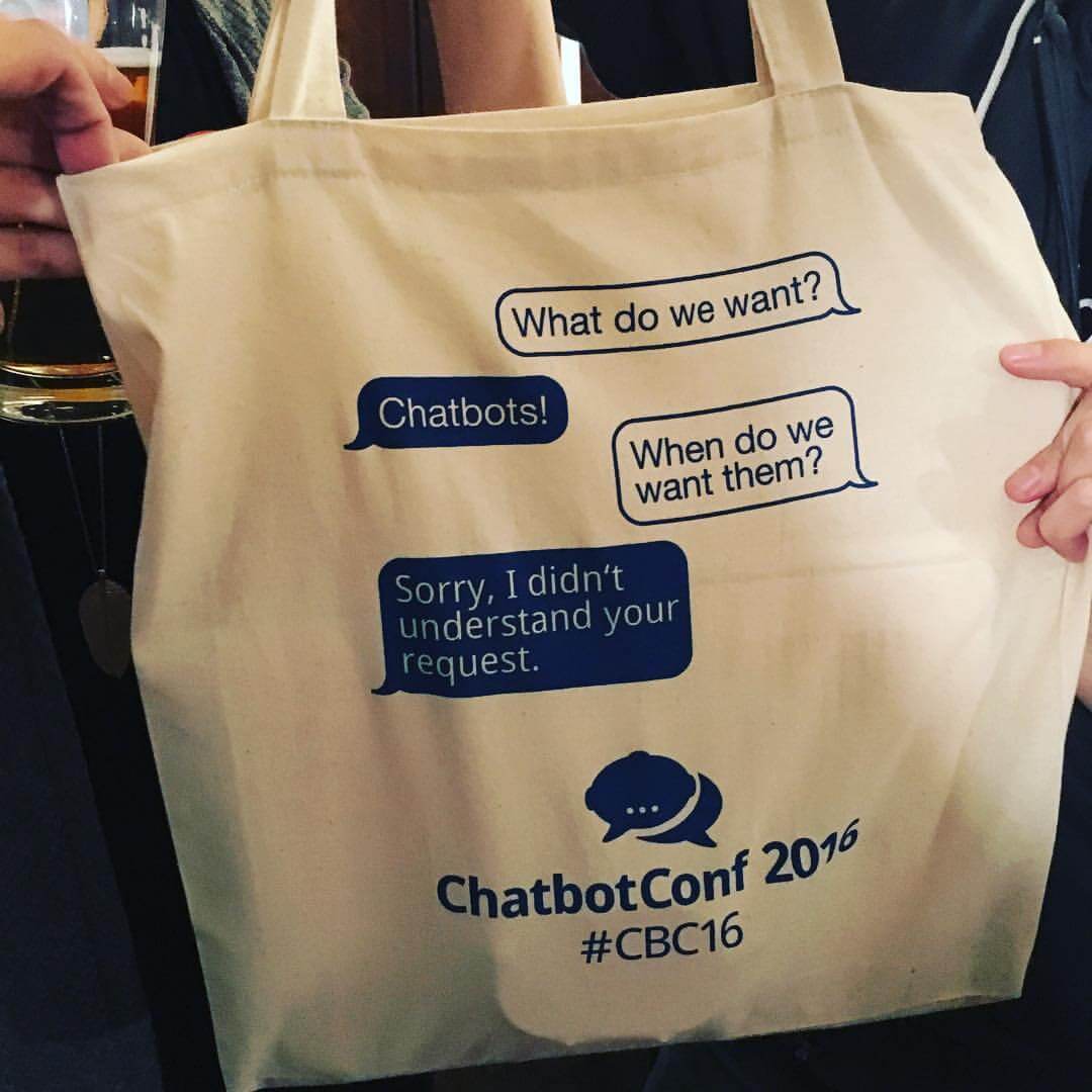 Chatbots for SMBs — AI or Rule-based? a telling tote bag humoring early chatbots, available to participants of ChatbotConf 2016